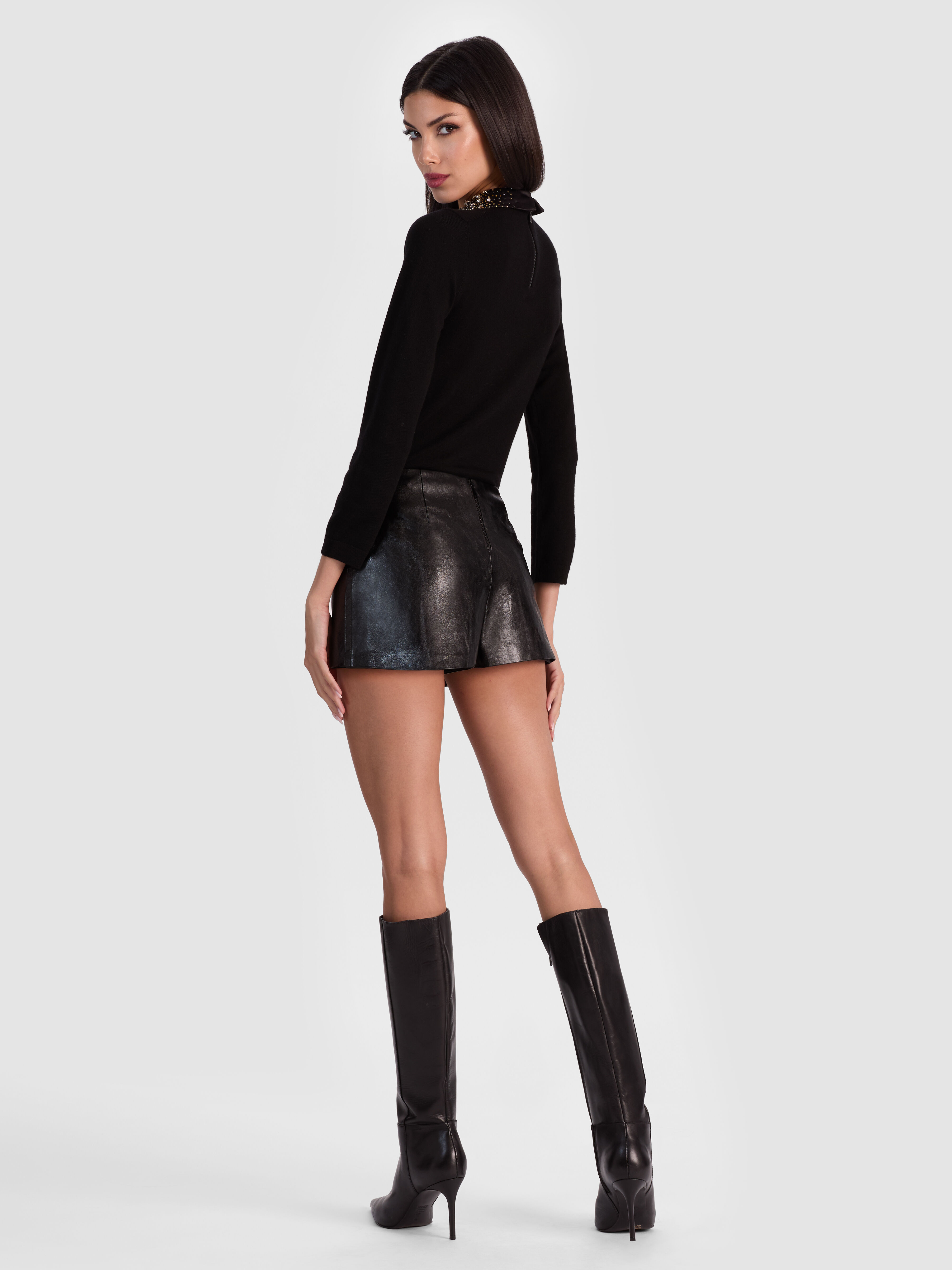 ALICE + OLIVIA Mace Vegan Mini Skort in Black — distressed vegan leather mini skort with built-in shorts