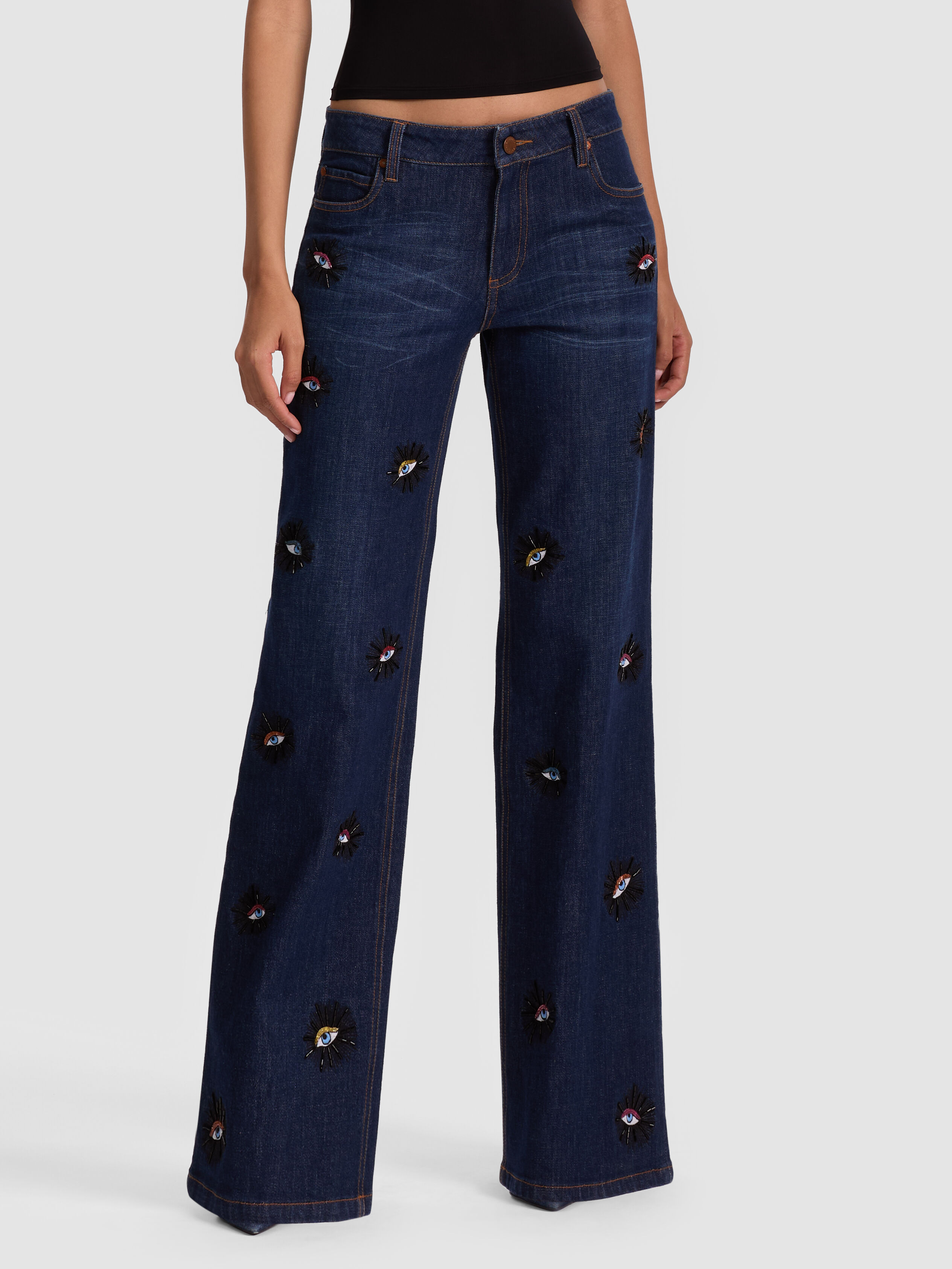 ALICE + OLIVIA Roxie Embellished Jean in Dark Wash Denim with hand-beaded eye motifs