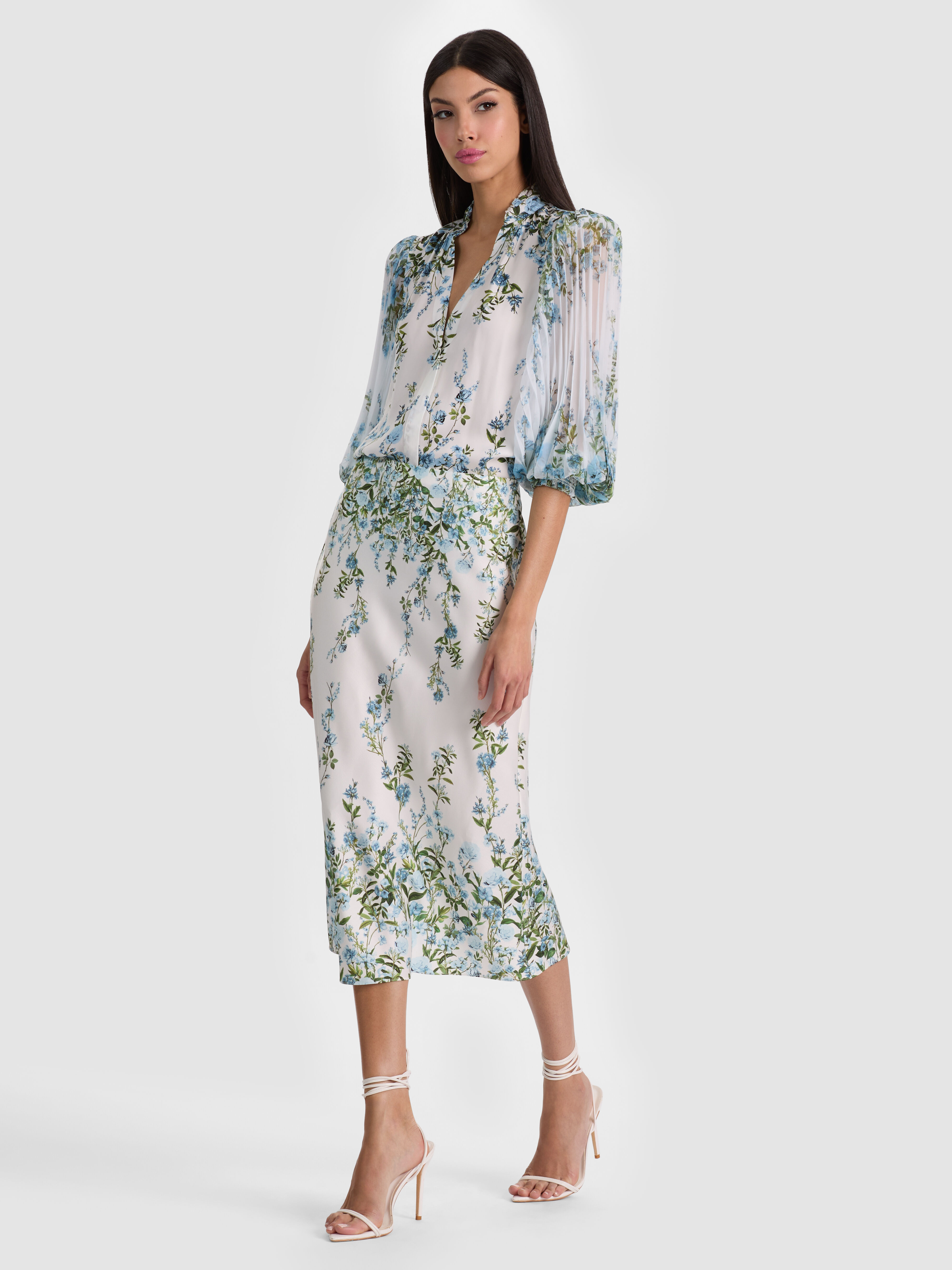 A versatile midi skirt falling between the knee and ankle, styled with heels for a date night look