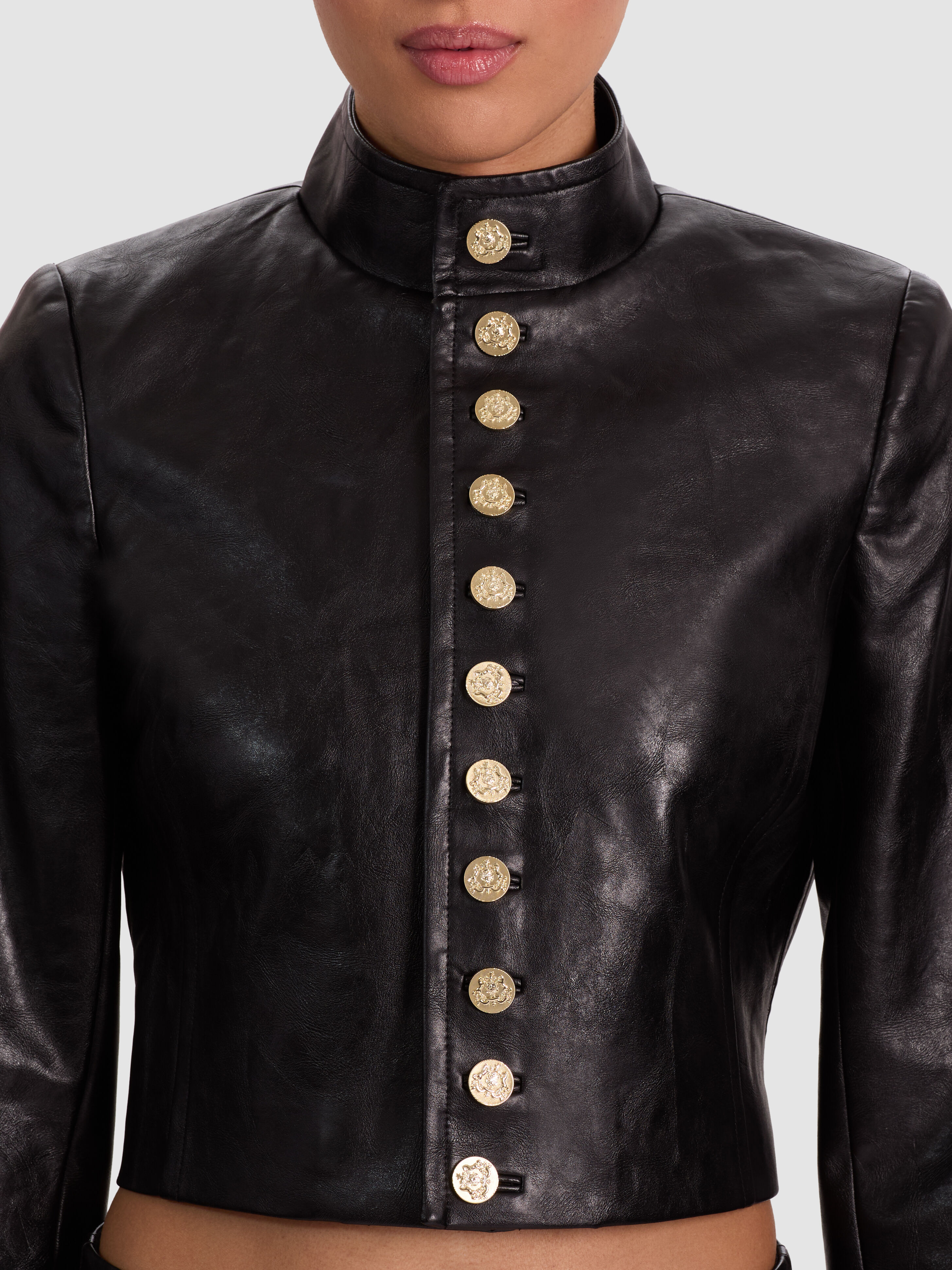 ALICE + OLIVIA Emerson Vegan Military Jacket in Black distressed vegan leather with gold button closures