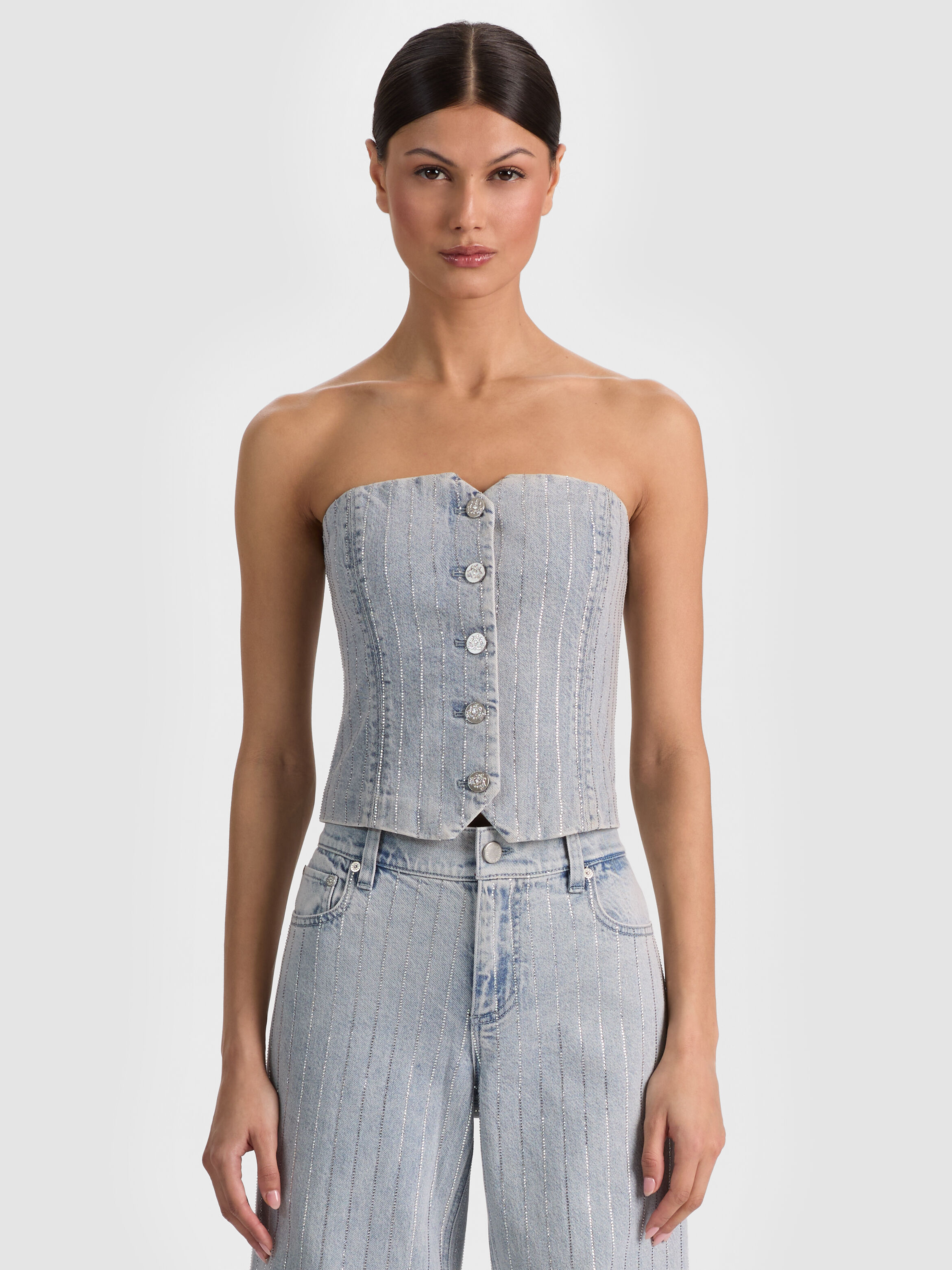 ALICE + OLIVIA Kelcey Strapless Embellished Denim Vest in crystal pinstripe denim with gold button closures