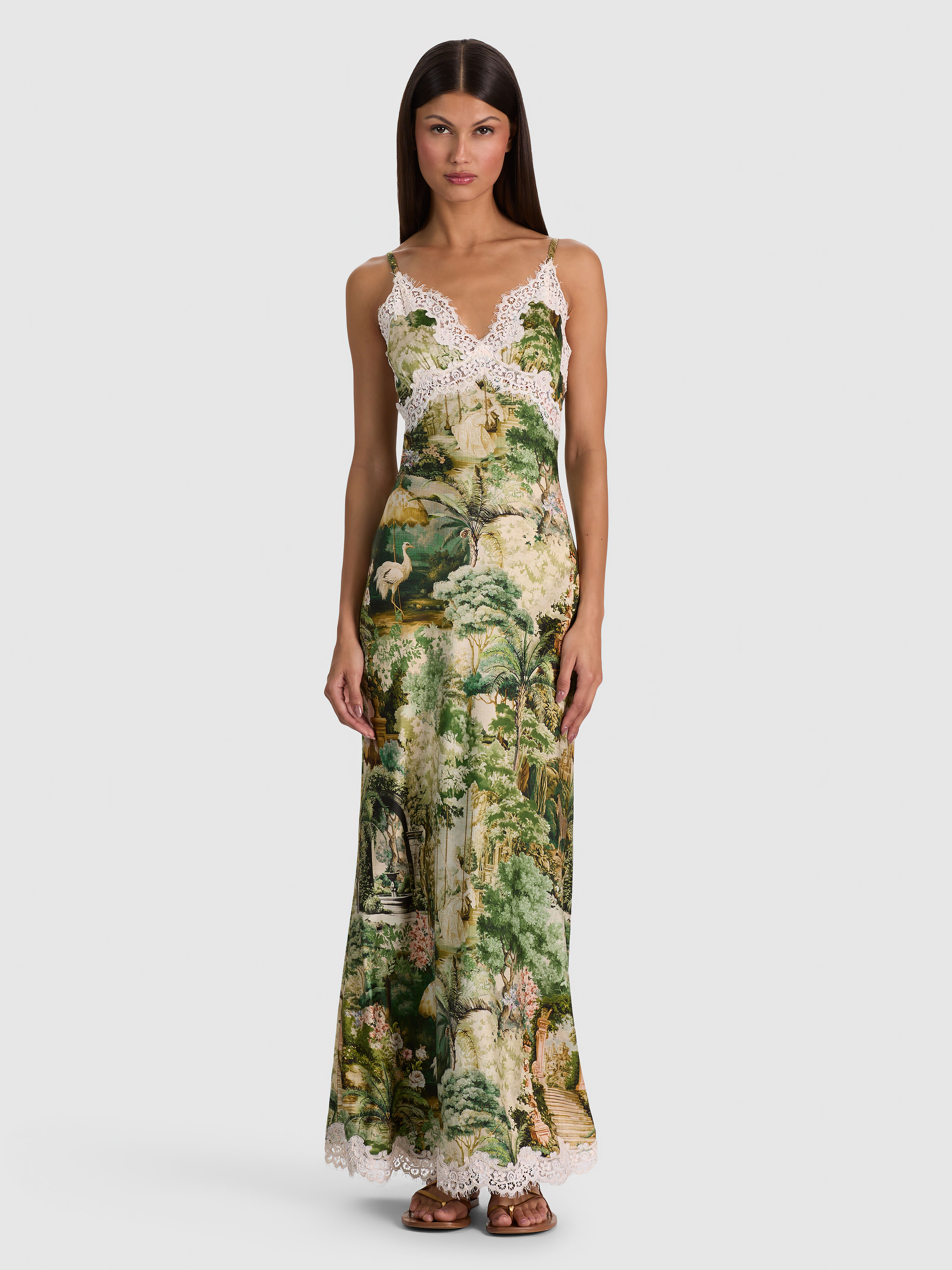 Multiple models wearing a variety of ALICE + OLIVIA midi dress styles, including the Julietta Lace Slip Dress, Gemma Midi Dress, Anya Midi Dress, and Nina Embellished Midi Dress.
